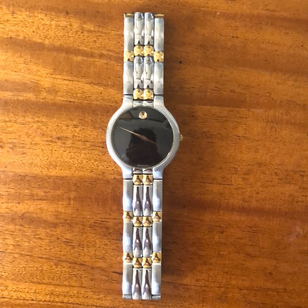 Steel/gold black face movado used great condition